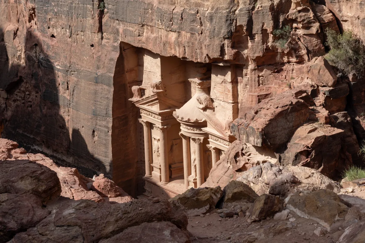 A shadowed, lesser-known rock-cut tomb off the main trail, Petra, Jordan