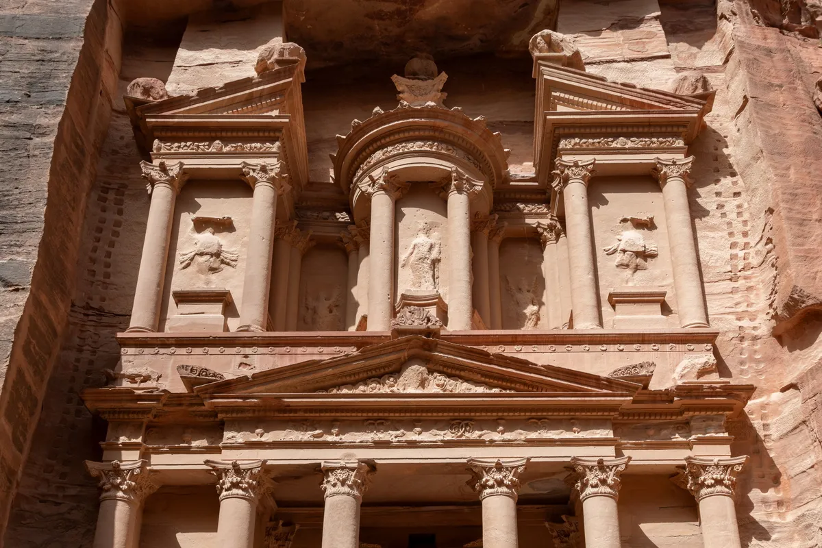 Close detail of the carved upper tier of the Treasury (Al-Khazneh), Petra, Jordan